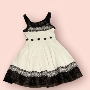 Bonnie Jean white dress with floral prints on the front and lace on the bottom